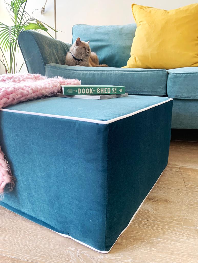 Teal Blue velvet pouffe with blanket and book